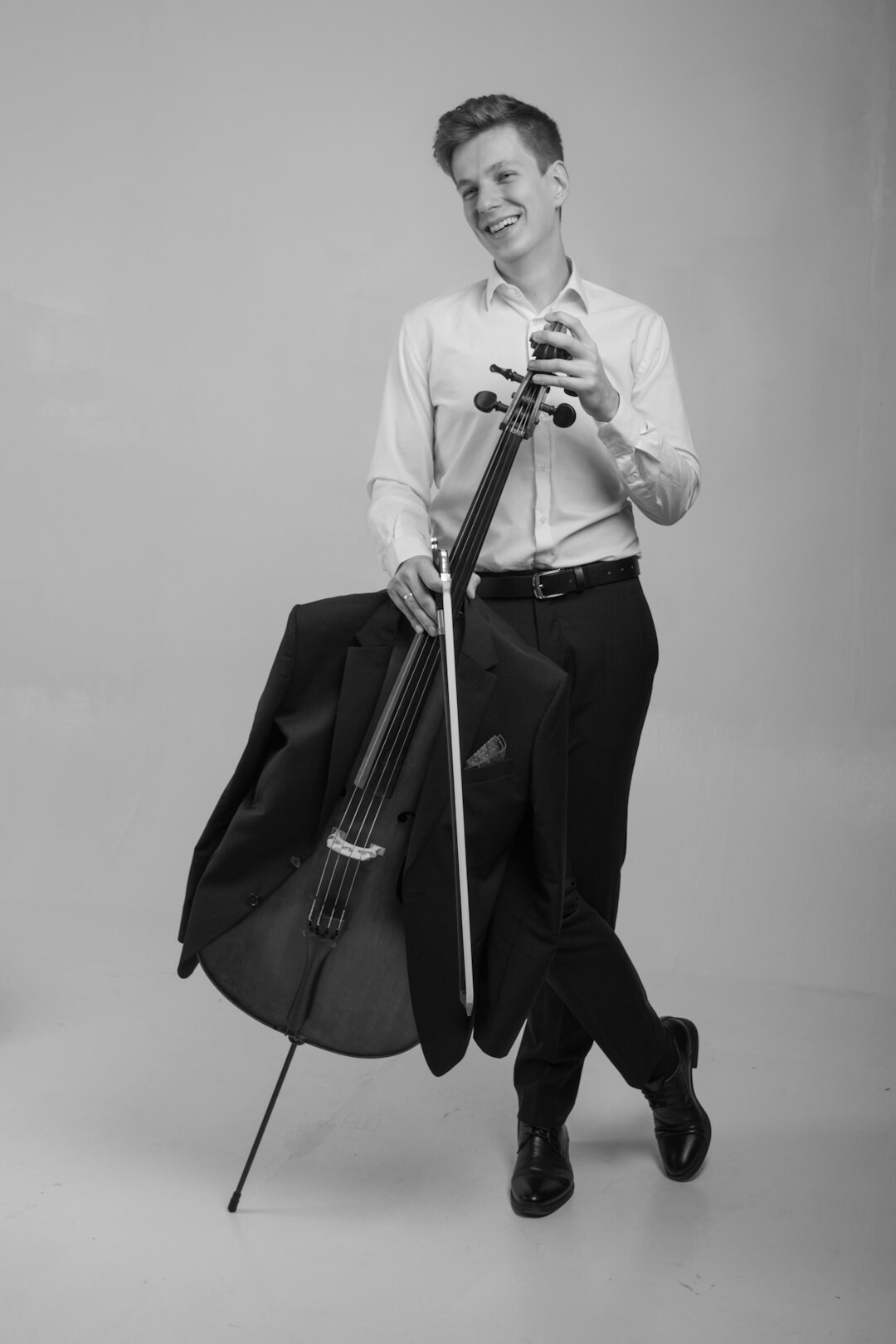 Portrait of a Uruguayan musician holding a guitar in a studio