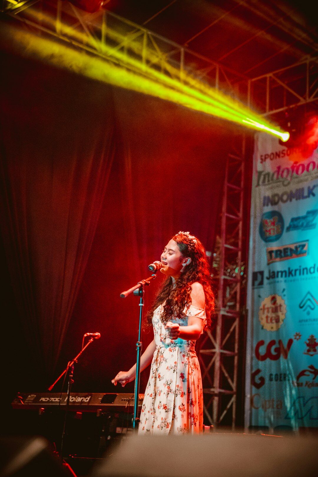 woman singing on stage